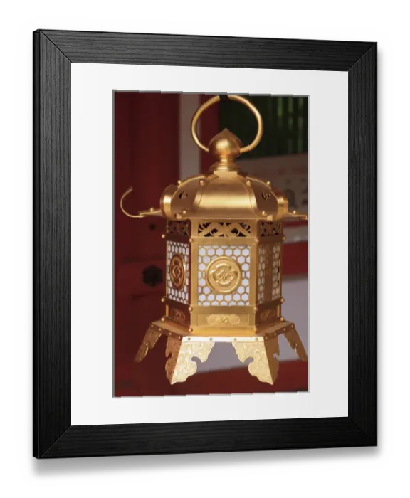 Framed Print : Smaller metal and gold lanterns are representations of their ancient stone siblings