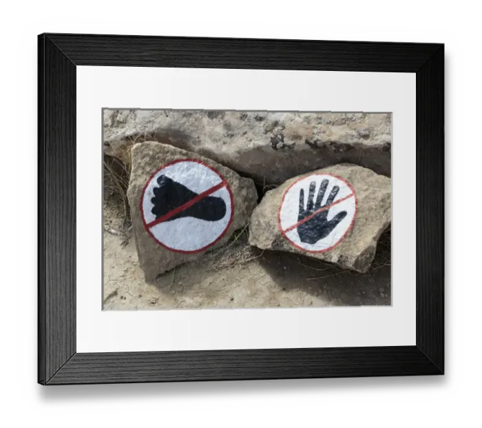 Framed Print : Azerbaijan, Qobustan. A warning to not touch or walk on the rocks at Gobustan National