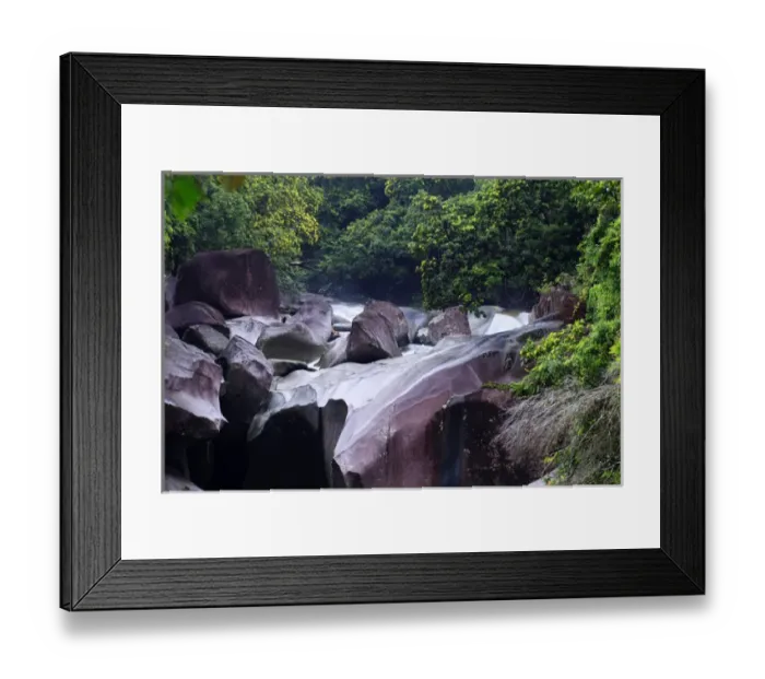 Framed Print : The Babinda Boulders is a fast-flowing river surrounded by smooth boulders and a Framed Print : The Babinda Boulders is a fast-flowing river surrounded by smooth boulders and a