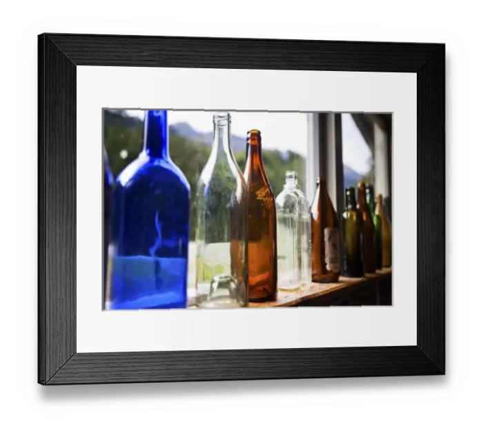 Framed Print : Antique glass bottles line the windowsill of a building, Gunns Camp, Hollyford Valley Framed Print : Antique glass bottles line the windowsill of a building, Gunns Camp, Hollyford Valley
