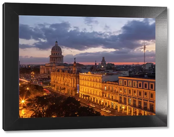Cuba, Havana. Twilight over the city with the capitol and other historical buildings