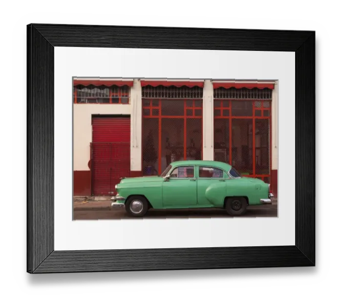 Framed Print : Cuba, Havana. Green car, red building on the streets