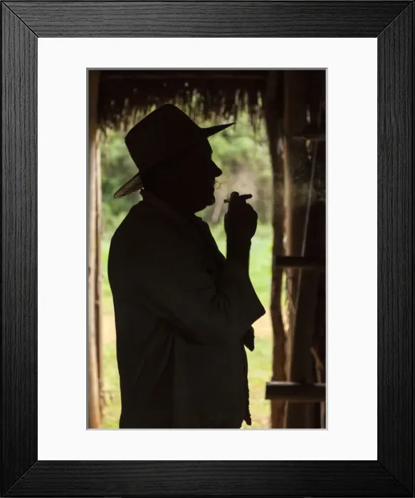 Framed Print : Cuba, Vinales. Silhouette of a tobacco farmer smoking a cigar Framed Print : Cuba, Vinales. Silhouette of a tobacco farmer smoking a cigar