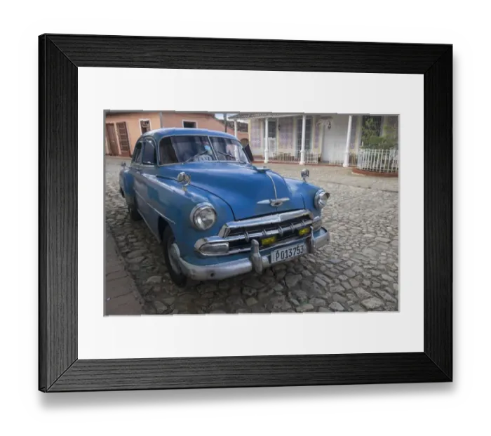 Framed Print : Cuba, Trinidad. Blue taxi parked on cobblestones