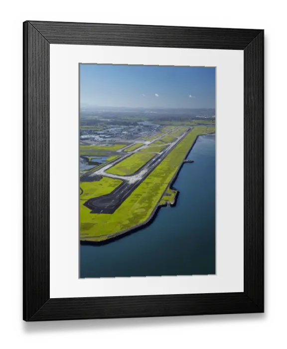 Framed Print : Runway at Auckland Airport, and Manukau Harbour, North Island, New Zealand - aerial Framed Print : Runway at Auckland Airport, and Manukau Harbour, North Island, New Zealand - aerial