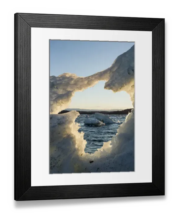 Framed Print : Canada, Nunavut, Territory, View of White Island through hole in melting iceberg Framed Print : Canada, Nunavut, Territory, View of White Island through hole in melting iceberg