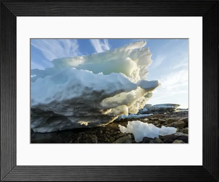 Framed Print : Canada, Nunavut Territory, Melting iceberg stranded by low tide along Frozen Channel