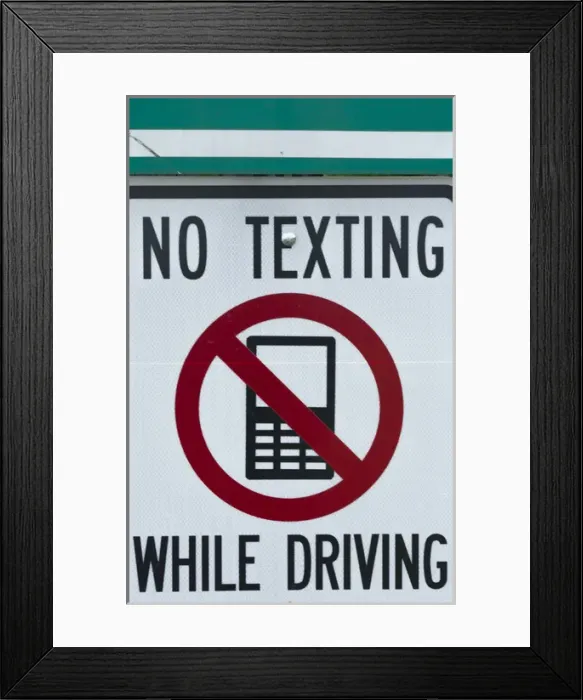 Framed Print : NO TEXTING WHILE DRIVING sign dangerous practice Framed Print : NO TEXTING WHILE DRIVING sign dangerous practice
