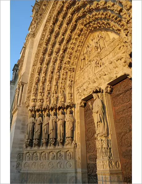 Europe, France, Paris. Door arches with carved saints, Notre Dame Cathedral