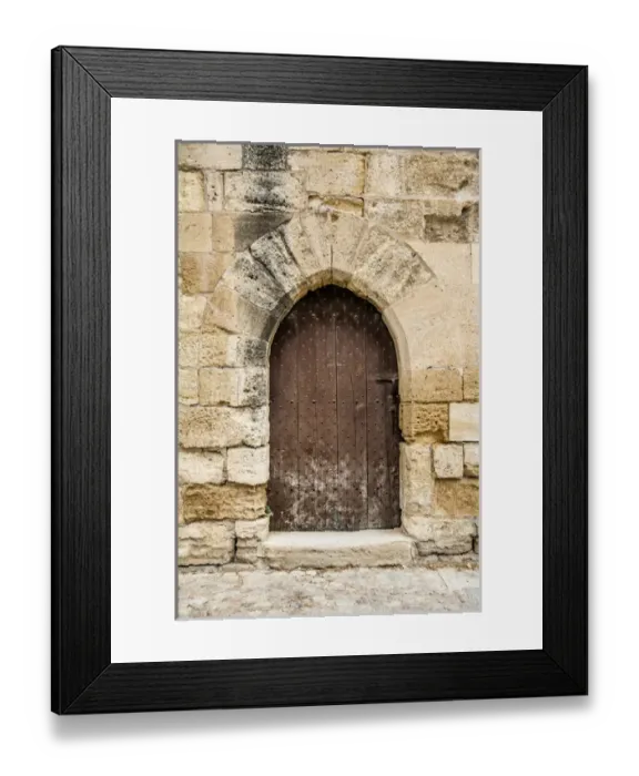 Framed Print : french medieval arched door in stone wall Framed Print : french medieval arched door in stone wall