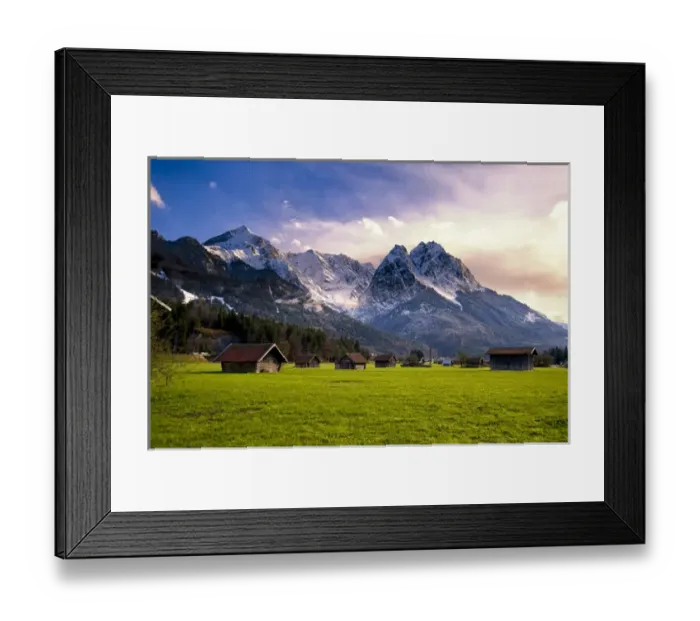 Framed Print : Huts in field at base of Bavarian Alps with snow at sunset