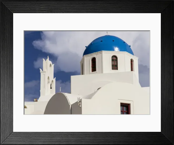 Framed Print : Blue Roofed Churches and homes are everywhere on the Island. Santorini. Greece