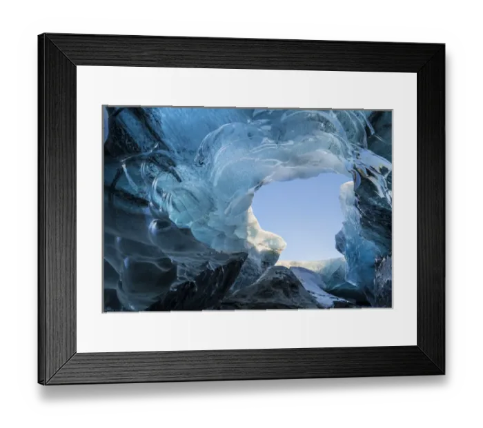 Framed Print : Ice cave in the glacier Breidamerkurjoekull in Vatnajoekull National Park. Entrance to the Ice Cave