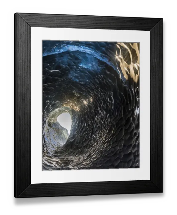 Framed Print : Ice cave in the glacier Breidamerkurjoekull in Vatnajoekull National Park. Entrance to the Ice Cave