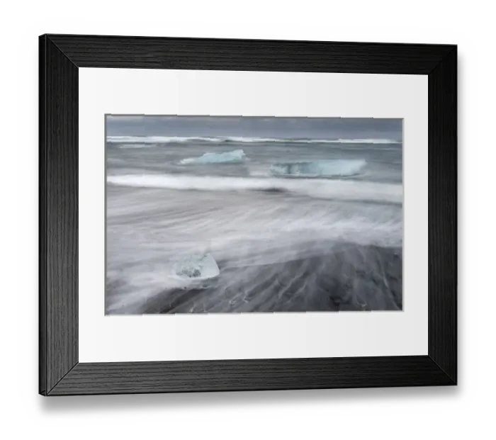 Framed Print : icebergs on black volcanic beach. Beach of the north atlantic near the glacial lagoon Joekulsarlon