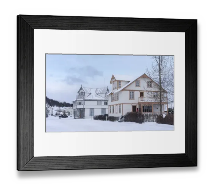 Framed Print : Akureyri during winter. Old town with traditional and historic buildings