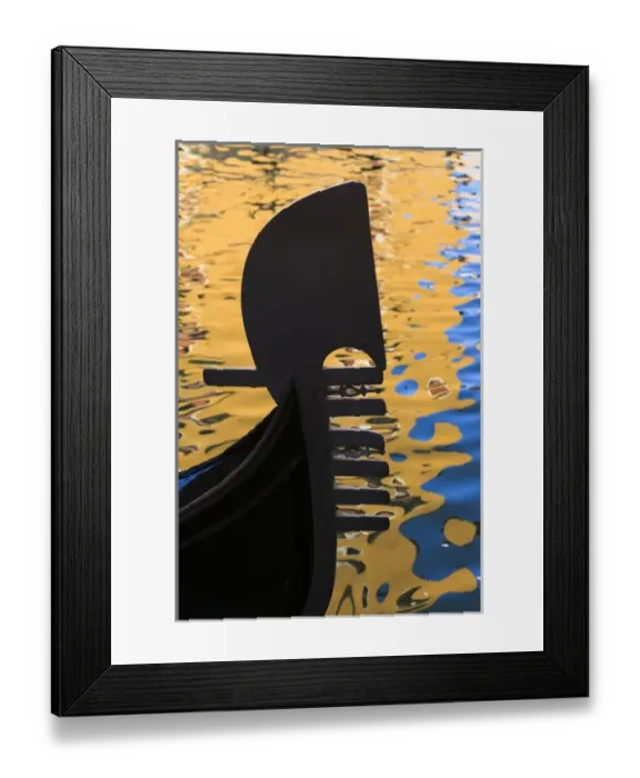 Framed Print : Italy, Venice. A silhouette of a gondola against colorful water reflections Framed Print : Italy, Venice. A silhouette of a gondola against colorful water reflections