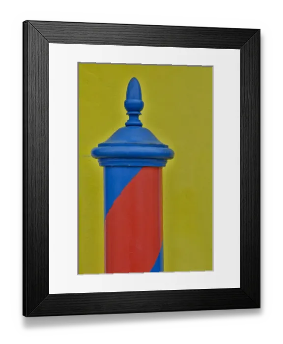 Framed Print : Red & Blue painted and stripped pole with Yellow Home as backdrop, Burano Italy Framed Print : Red & Blue painted and stripped pole with Yellow Home as backdrop, Burano Italy
