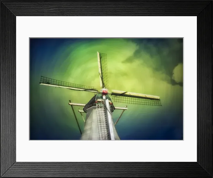 Framed Print : A lone windmill stands against the blue-green sky and clouds in swirl pattern Framed Print : A lone windmill stands against the blue-green sky and clouds in swirl pattern