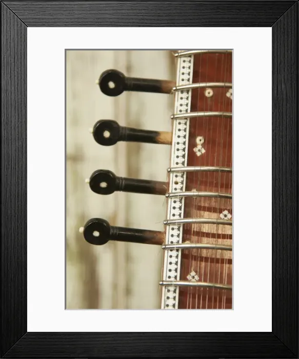 Framed Print : Close up abstract of a wood indian sitar string insturment of music in India