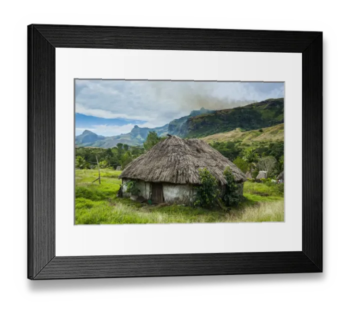 Framed Print : Traditional thached roofed huts in Navala in the Ba Highlands of Viti Levu, Fiji