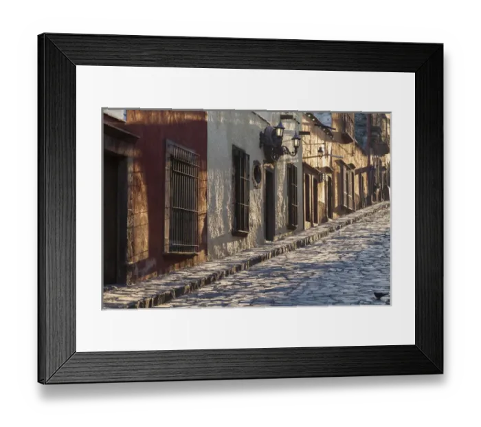 Framed Print : Mexico, San Miguel de Allende. Sunlight streams down a cobblestone lane in the village Framed Print : Mexico, San Miguel de Allende. Sunlight streams down a cobblestone lane in the village
