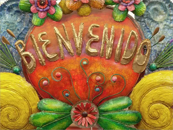 Mexico, San Miguel de Allende. A colorful metal sign saying Welcome is