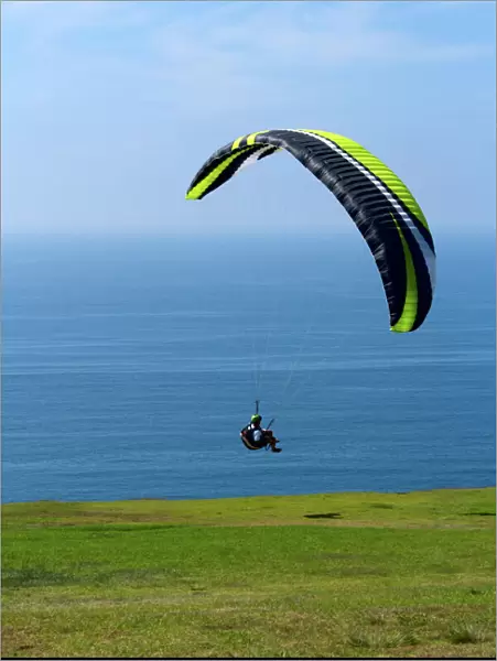 USA, California, San Diego. Hang glider taking off at Torrey Pines Gliderport. Credit as