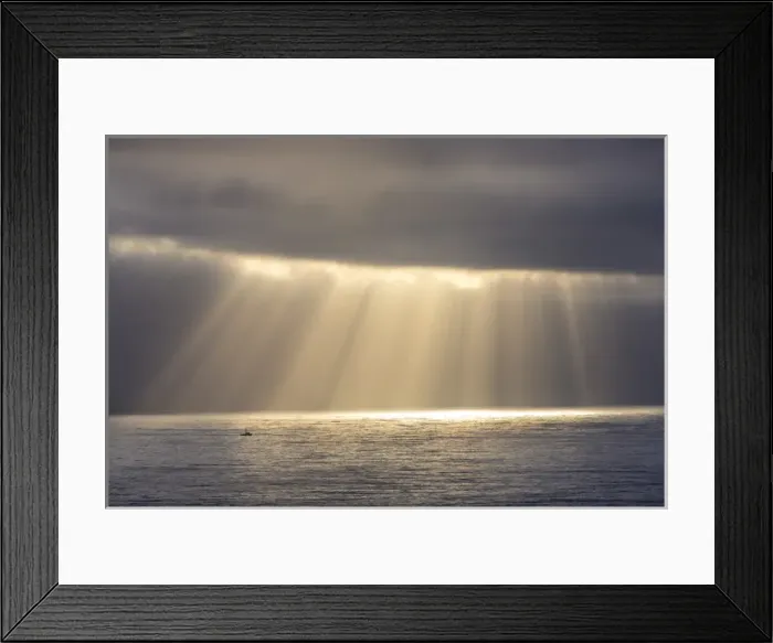 Framed Print : Rays emit from the clouds over the Pacific Ocean as fishing boat passes by near Santa Cruz Framed Print : Rays emit from the clouds over the Pacific Ocean as fishing boat passes by near Santa Cruz