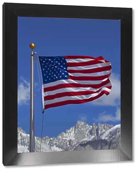 American flag and snow on Sierra Nevada Mountain Range, California, USA