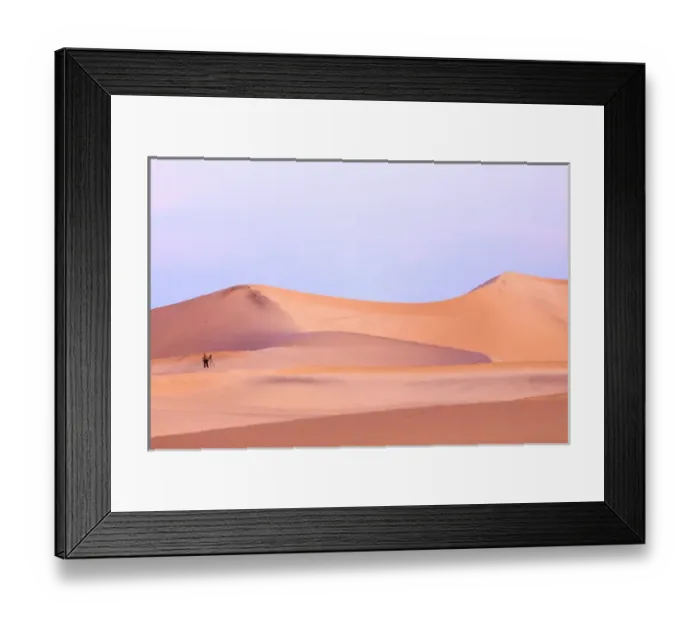 Framed Print : A photographer stands in sunrise light in the Mesquite Dunes, Death Valley National Park