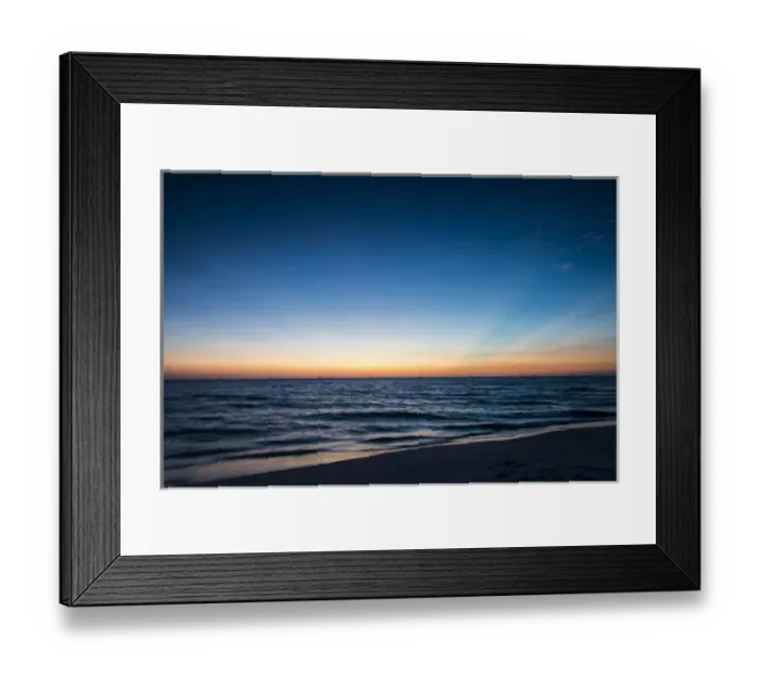 Framed Print : Afterglow of light streaking deep blue sky of sunset scene