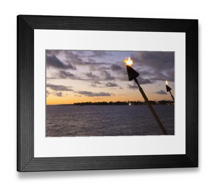 Framed Print : Kona Hawaii Big Island tiki fire light over Ocean at Kailua-Kona beach at sunset Framed Print : Kona Hawaii Big Island tiki fire light over Ocean at Kailua-Kona beach at sunset