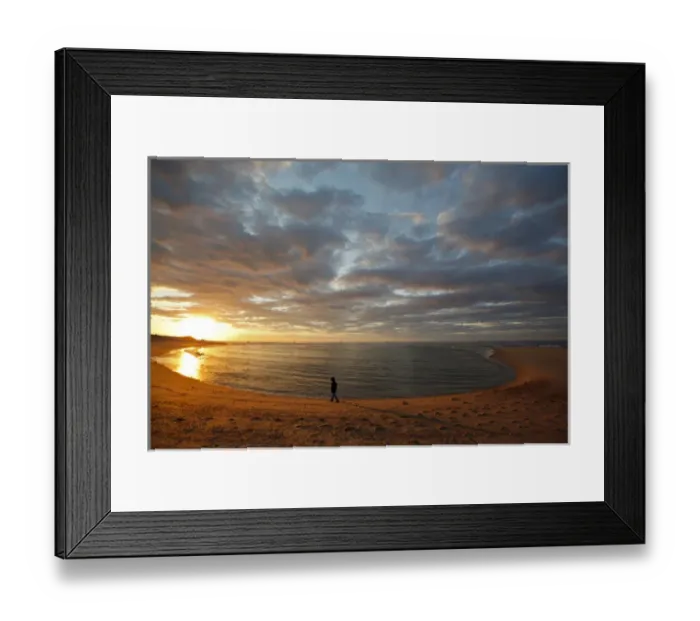 Framed Print : A girl walks on the beach a the sun sets over Head of the Meadow Beach at the Cape