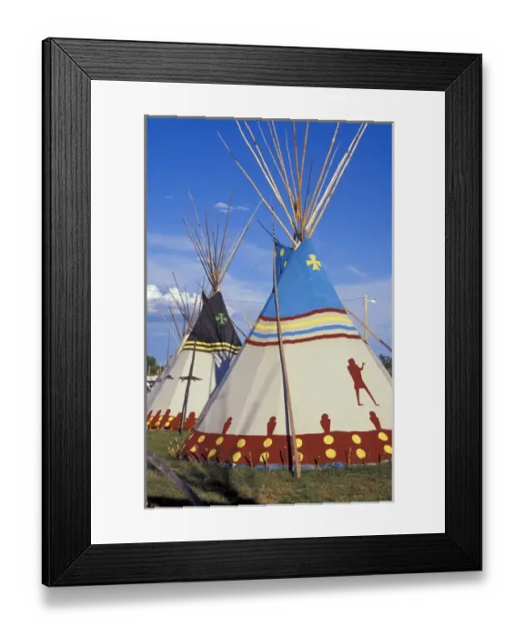 Framed Print : Colorfully painted with decorative designs on Blackfeet tepees made from canvas stretched