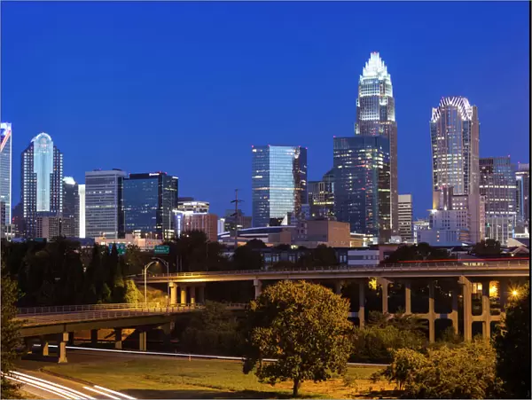 USA, North Carolina, Charlotte, elevated view of the city skyline from Route 74, dawn