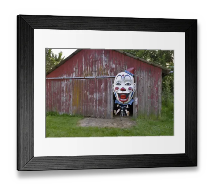 Framed Print : USA, Oregon, Oregon City. Clown face on bike in door of red barn Framed Print : USA, Oregon, Oregon City. Clown face on bike in door of red barn