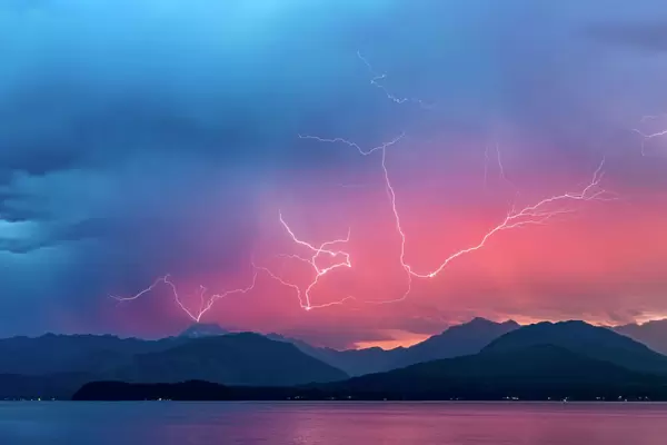 USA, Washington, Seabeck. Lightning over Hood Canal and Olympic Mountains. Credit as