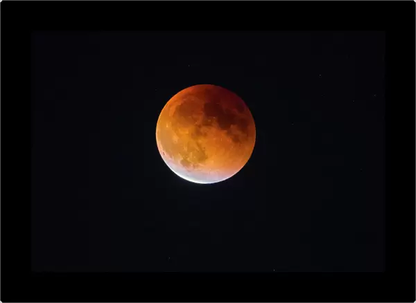 USA, Washington State. Begginning of the end of Blood Moon (lunar eclipse) in Seattle