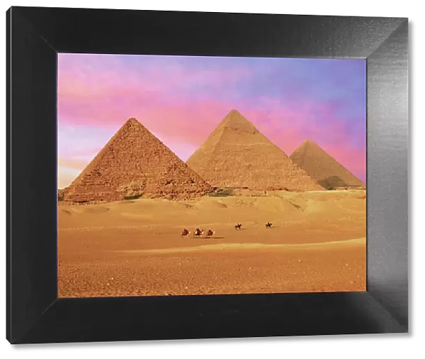 Egypt, Cairo, Giza, View of all three Great Pyramids at sunset