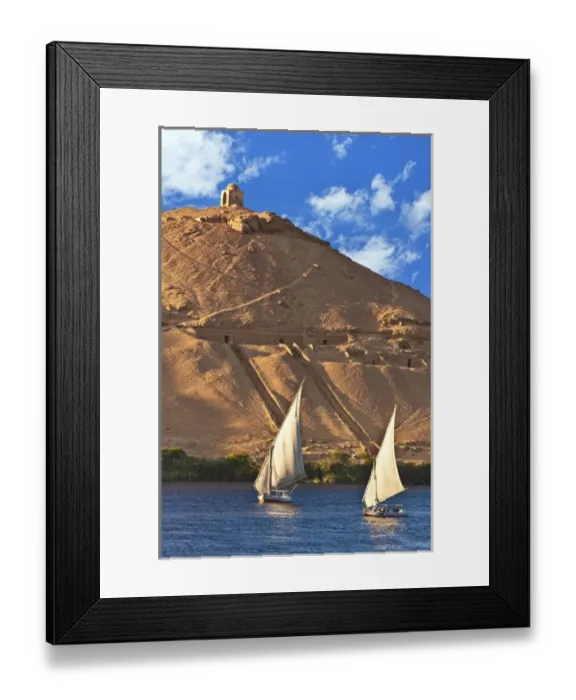 Framed Print : Egypt, Aswan, Nile River, Felucca sailboats, temple ruins and the large sand dunes Framed Print : Egypt, Aswan, Nile River, Felucca sailboats, temple ruins and the large sand dunes