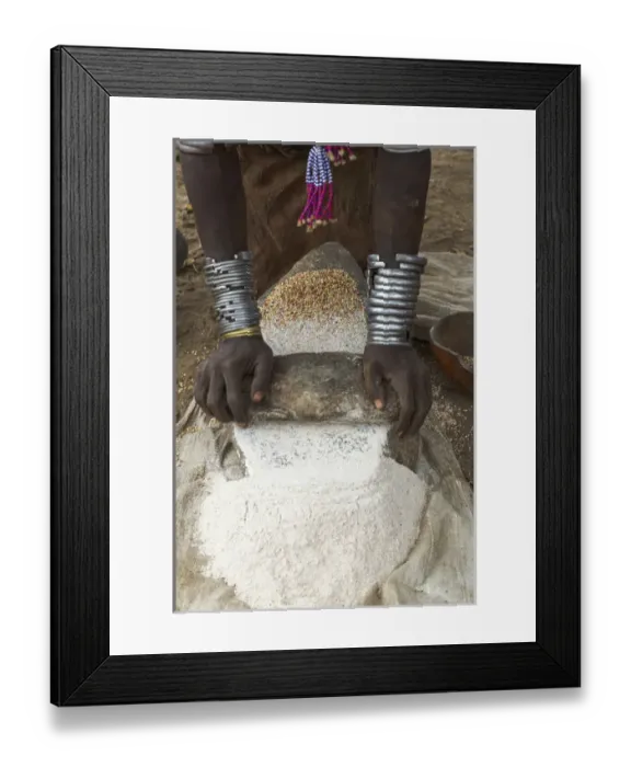 Framed Print : Africa, Ethiopia, Southern Omo, Karo Tribe. Woman grinding grain into flour with stone Framed Print : Africa, Ethiopia, Southern Omo, Karo Tribe. Woman grinding grain into flour with stone