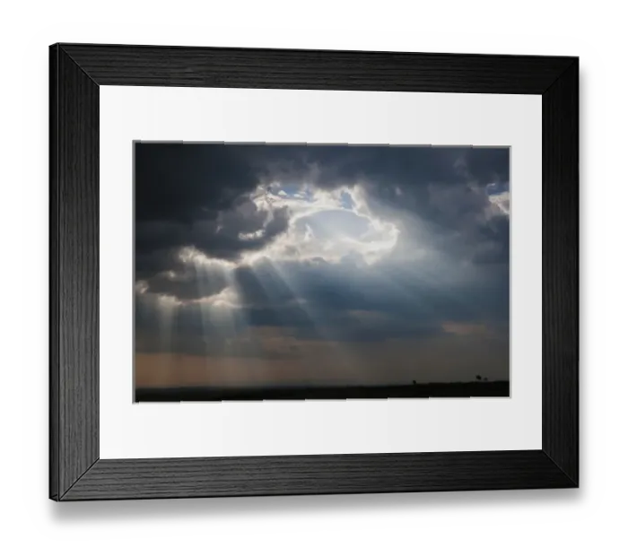 Framed Print : Sunlight breaking through the clouds after thunderstorm, Masai Mara National Reserve