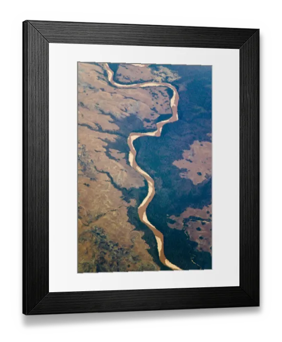Framed Print : Aerial view of river flowing through land below, Madagascar Framed Print : Aerial view of river flowing through land below, Madagascar