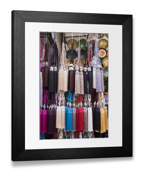 Framed Print : Africa, Morocco, Marrakech. Curtain tie-backs for sale at a market stall in the medina