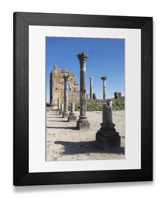 Framed Print : Africa, Morocco. Stone columns and remnants of an arch at the roman ruins of Volubilis Framed Print : Africa, Morocco. Stone columns and remnants of an arch at the roman ruins of Volubilis