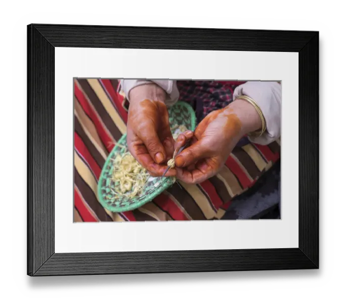 Framed Print : North Africa, Morocco, Bhalil woman with hennaed hands making buttons