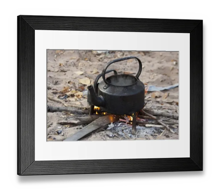 Framed Print : Africa, Namibia, Bushmanland, Nhoma. Kettle heats on an open fire in the Bushman village Framed Print : Africa, Namibia, Bushmanland, Nhoma. Kettle heats on an open fire in the Bushman village