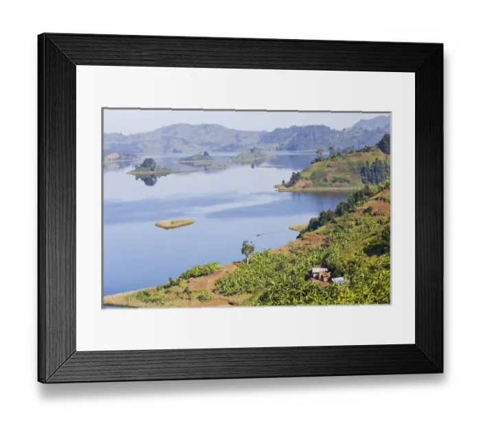 Framed Print : Lake Mutanda near Kisoro in Uganda. On the shoreline the land is cultivated, very Framed Print : Lake Mutanda near Kisoro in Uganda. On the shoreline the land is cultivated, very