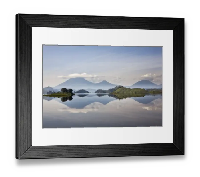 Framed Print : Lake Mutanda near Kisoro with the Virunga Vulcanoes as reflection in the lake Framed Print : Lake Mutanda near Kisoro with the Virunga Vulcanoes as reflection in the lake